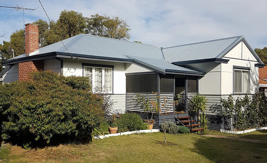 Elevation of older re-roofed house with verandurah